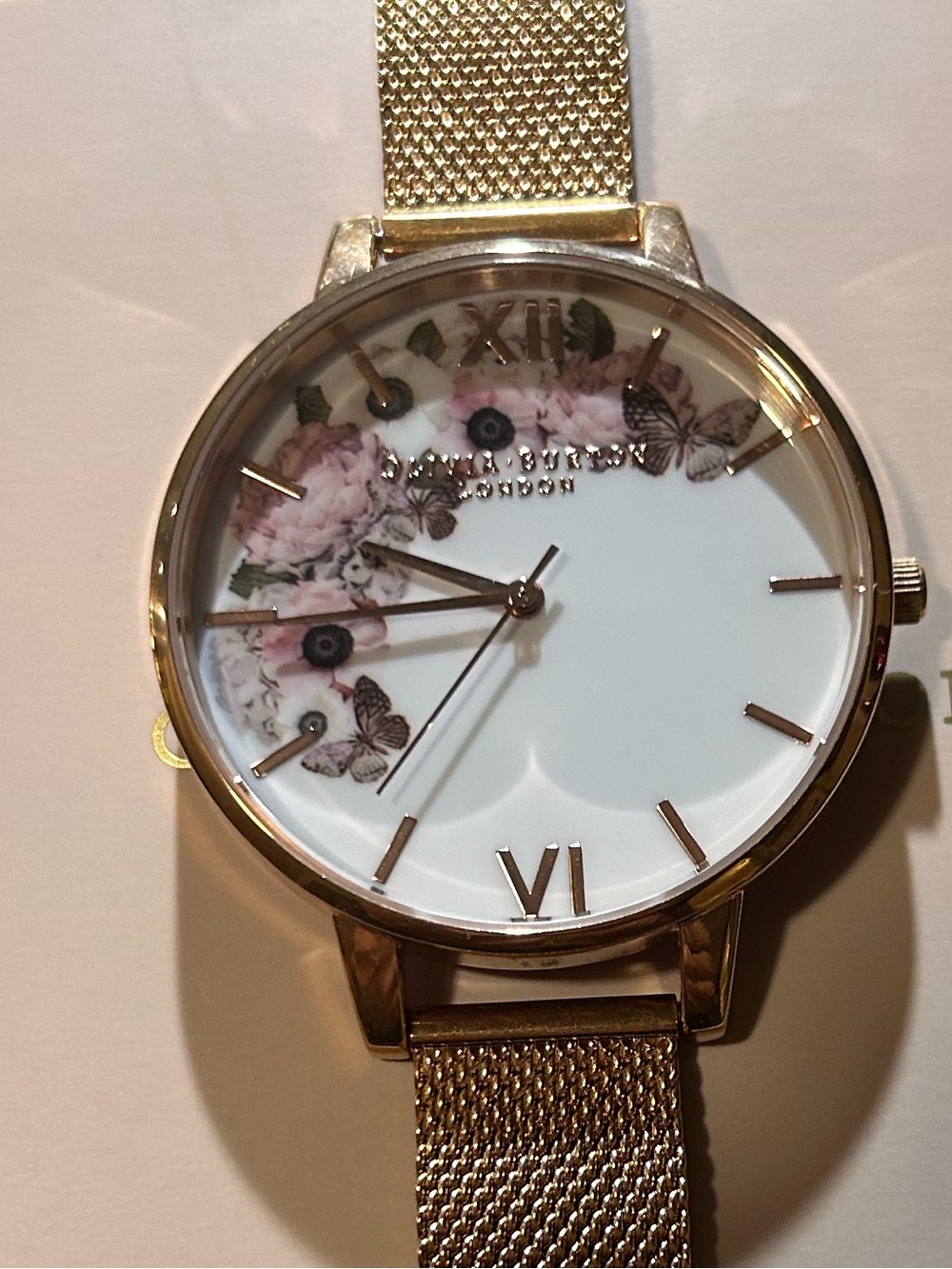 OLIVIA BURTON WATCH WITH 38mm WHITE MULTICOLOR FLORAL PATTERN FACE.